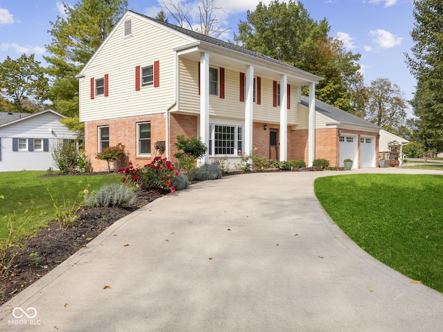 view of front of house featuring a garage and a front yard