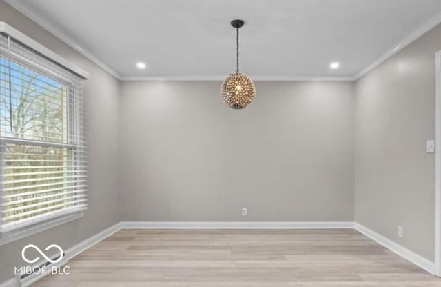 unfurnished room with a healthy amount of sunlight, light wood-type flooring, and ornamental molding