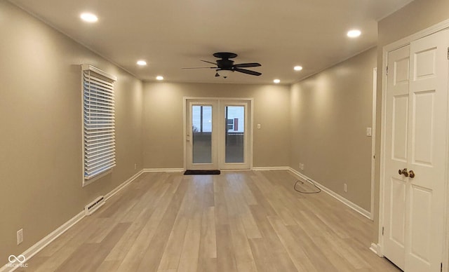 spare room featuring ceiling fan and light wood-type flooring