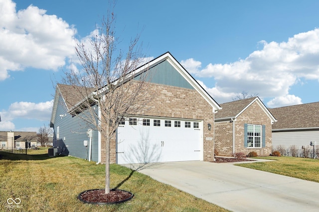 view of front property with cooling unit, a front lawn, and a garage