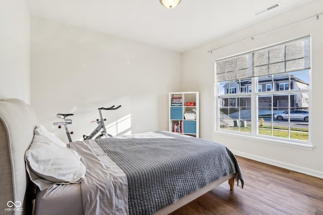 bedroom featuring wood-type flooring