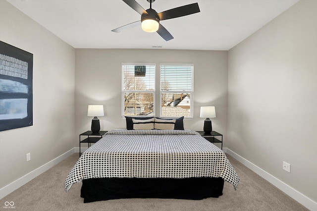 bedroom with visible vents, light colored carpet, and baseboards