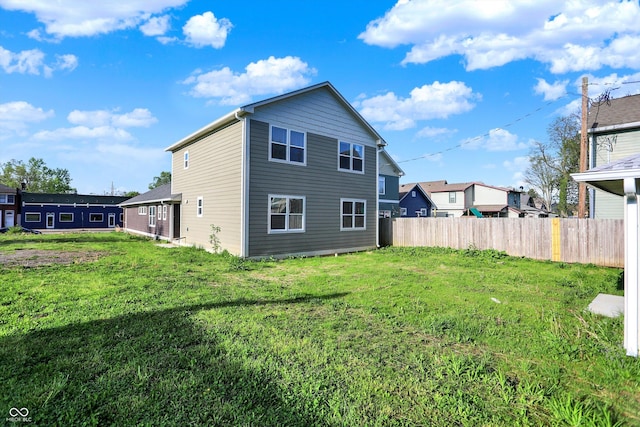 1622-1624 Prospect St, Indianapolis, IN 46203 - rear view of property featuring a lawn and fence