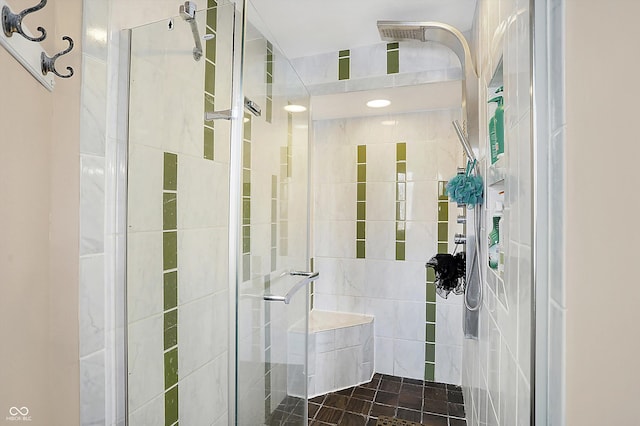 bathroom featuring a shower with door