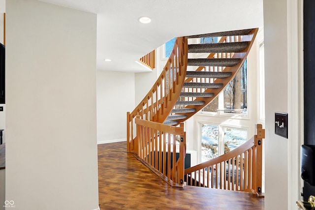 stairs with hardwood / wood-style flooring