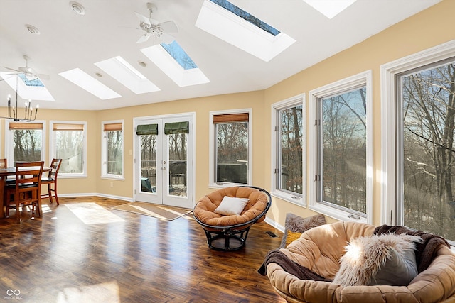 sunroom featuring vaulted ceiling, french doors, a healthy amount of sunlight, and ceiling fan