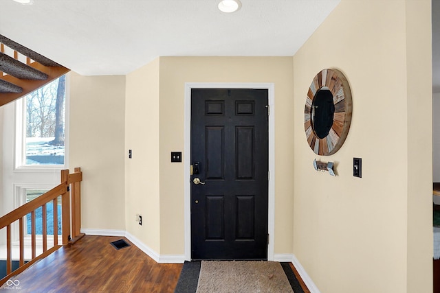 entrance foyer featuring dark wood-type flooring