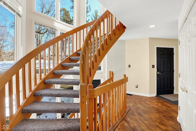 stairway featuring hardwood / wood-style flooring