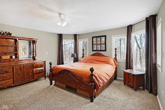 bedroom with light colored carpet and ceiling fan