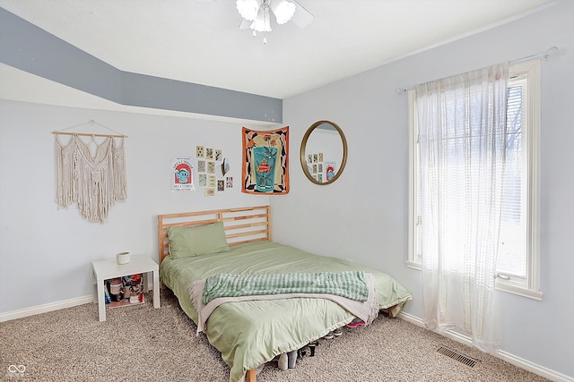 bedroom with ceiling fan and carpet floors