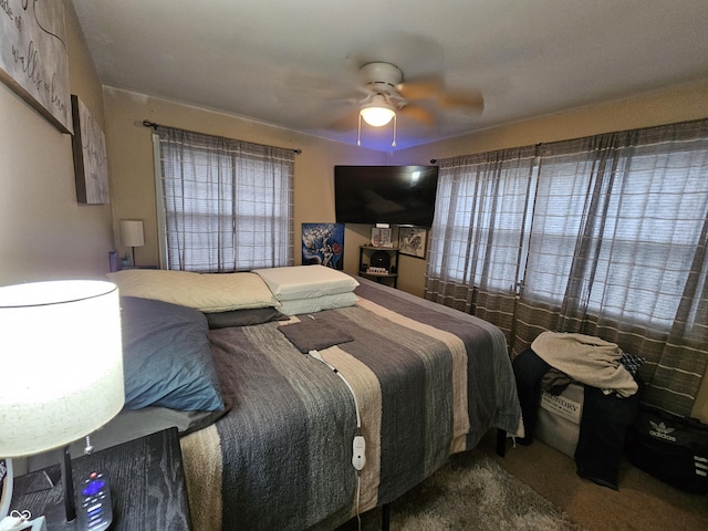 bedroom with ceiling fan and carpet