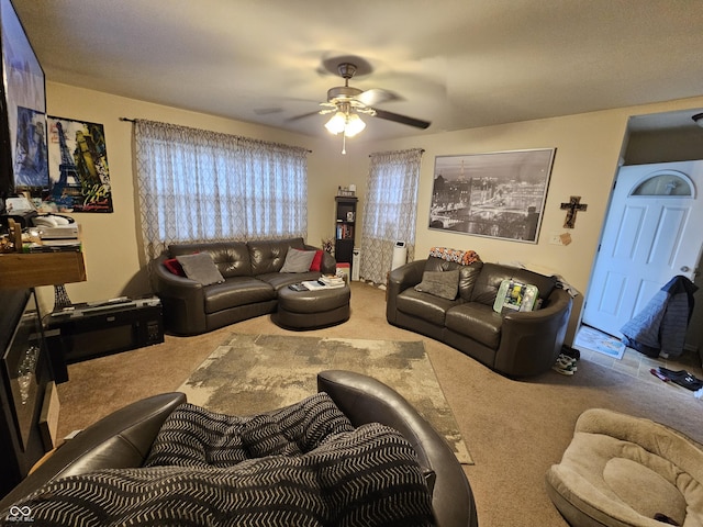 carpeted living room featuring ceiling fan