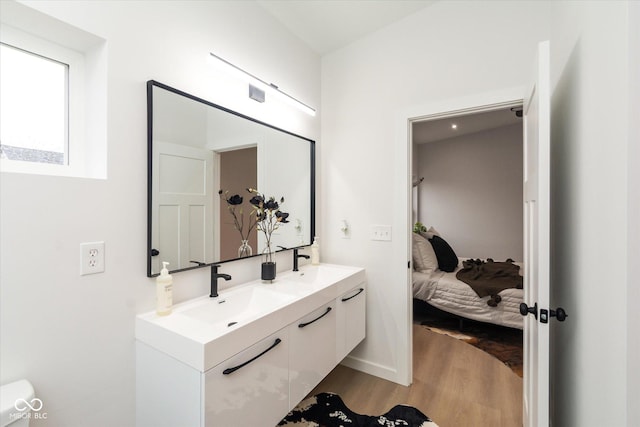 bathroom featuring vanity and hardwood / wood-style flooring