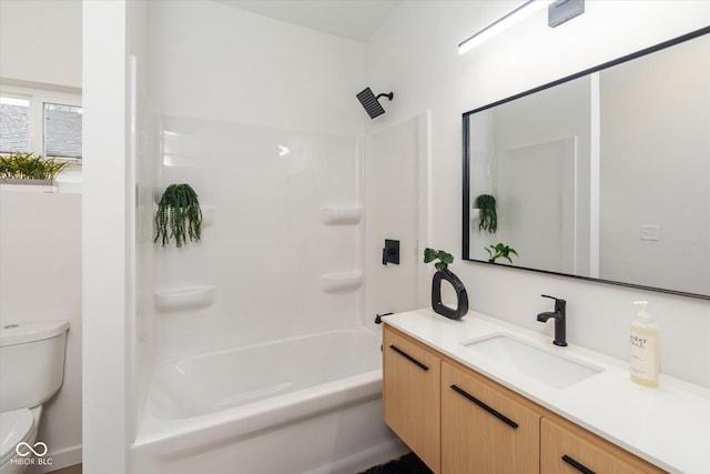 full bathroom featuring bathtub / shower combination, vanity, and toilet