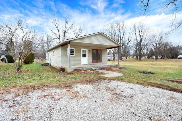 view of front of house featuring a front lawn and covered porch