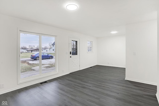 entrance foyer featuring dark hardwood / wood-style floors