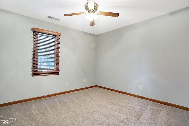 spare room with ceiling fan and carpet floors