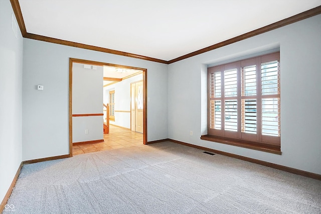 carpeted empty room featuring ornamental molding