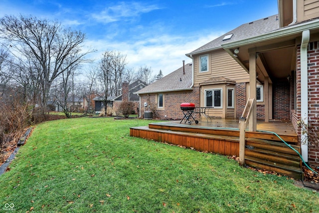 view of yard with a deck and cooling unit