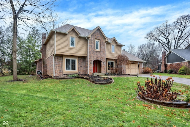 view of front of property with a front yard and a garage