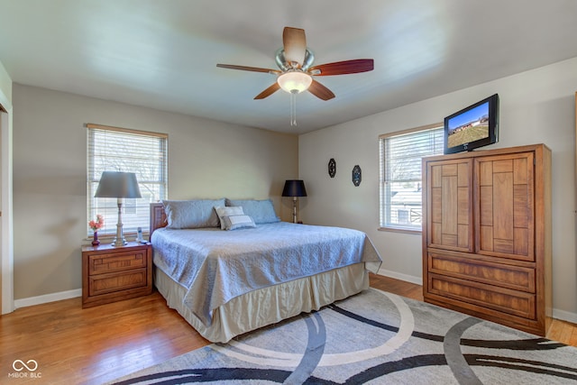 bedroom featuring ceiling fan and light hardwood / wood-style flooring