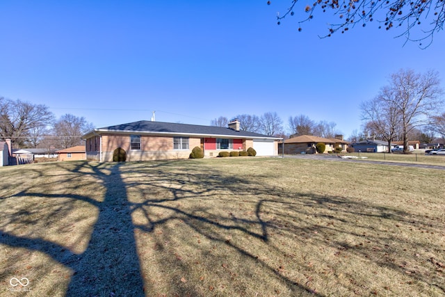 ranch-style home featuring a front yard