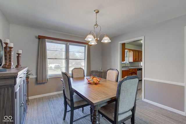 dining area with light colored carpet, sink, and a notable chandelier