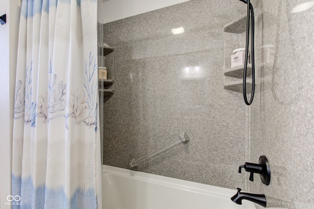 bathroom with shower / bath combination with curtain