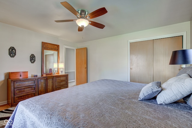 bedroom featuring ceiling fan and a closet