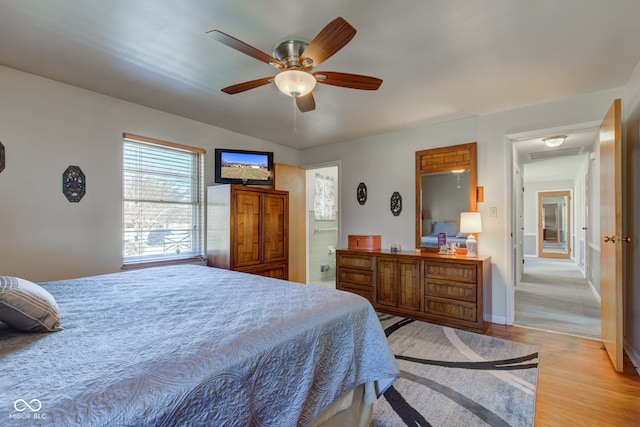 bedroom with ceiling fan and light wood-type flooring