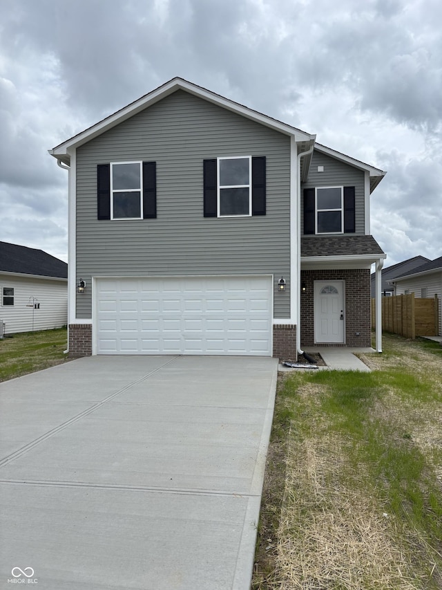 1433 Wigwam Ln, Martinsville, IN 46151 - view of front of property featuring a garage, brick siding, and concrete driveway
