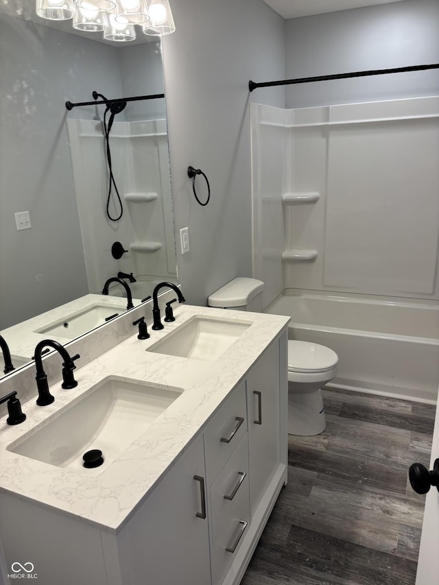 1433 Wigwam Ln, Martinsville, IN 46151 - bathroom with bathing tub / shower combination, wood finished floors, double vanity, and toilet