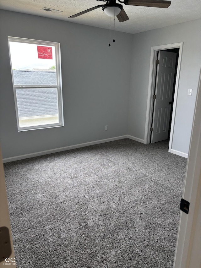 1433 Wigwam Ln, Martinsville, IN 46151 - carpeted empty room with a ceiling fan, baseboards, and a textured ceiling
