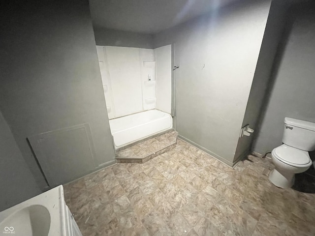 bathroom with toilet and shower / bathtub combination