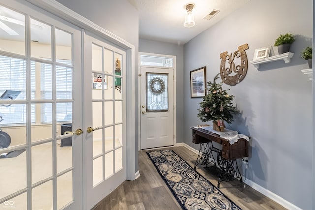 entryway with french doors and hardwood / wood-style floors