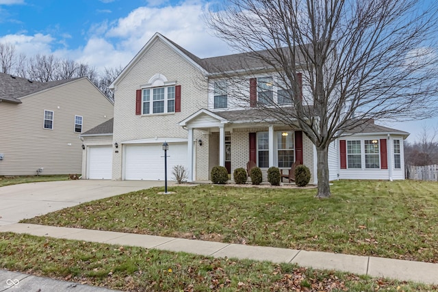 view of front of home featuring a front yard and a garage