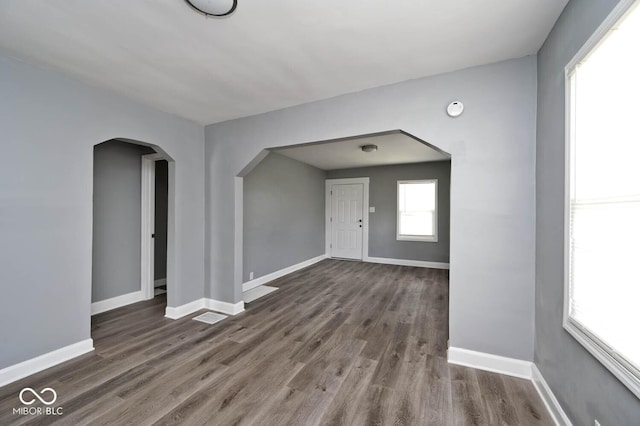 spare room with dark wood-type flooring