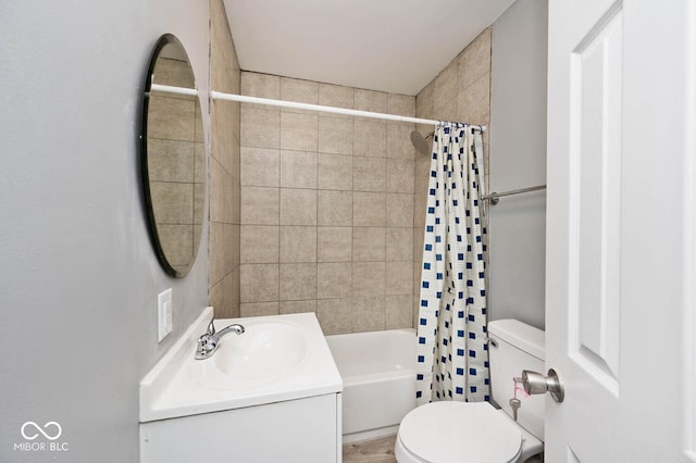 full bathroom featuring vanity, toilet, and shower / tub combo