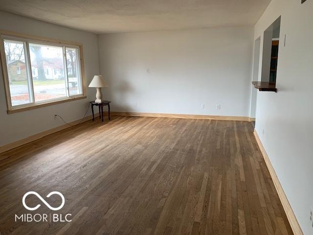 spare room featuring dark hardwood / wood-style floors