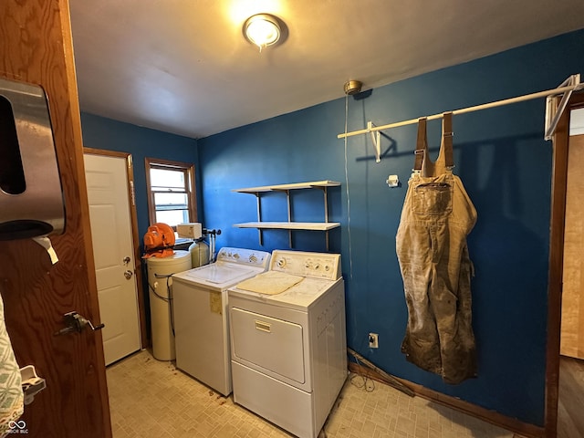 washroom with washing machine and clothes dryer