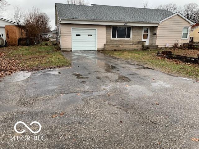 single story home featuring a garage