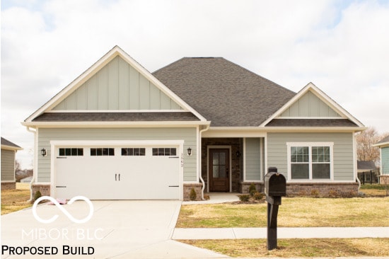 craftsman-style home with a front yard and a garage