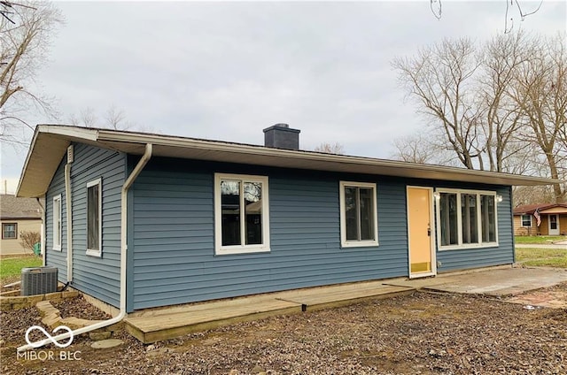 rear view of house featuring central AC and a patio