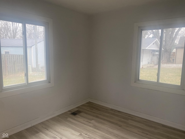 spare room featuring light hardwood / wood-style flooring