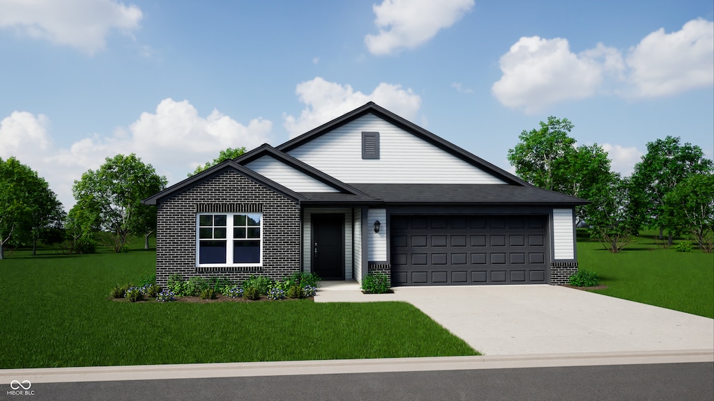 view of front of house with a garage and a front lawn