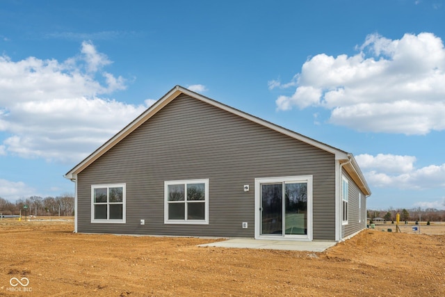 back of property with a patio