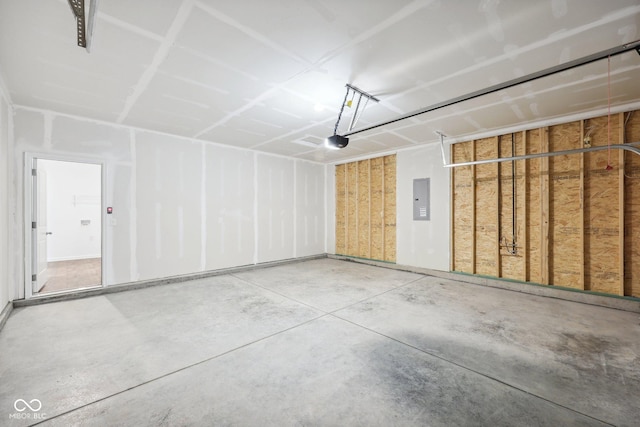 garage with electric panel and a garage door opener