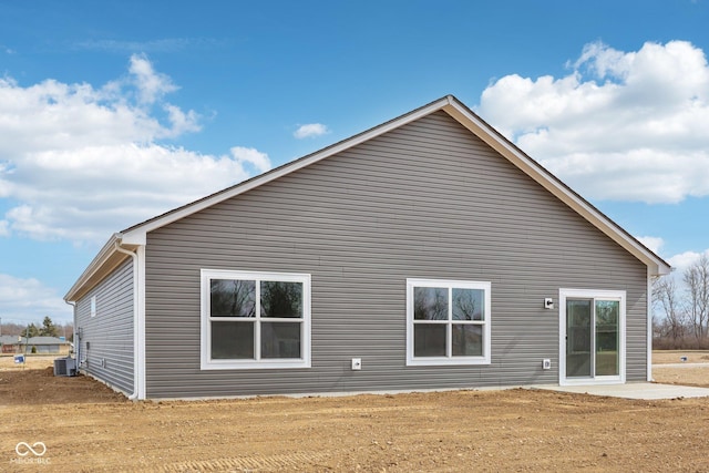 back of property featuring central AC unit