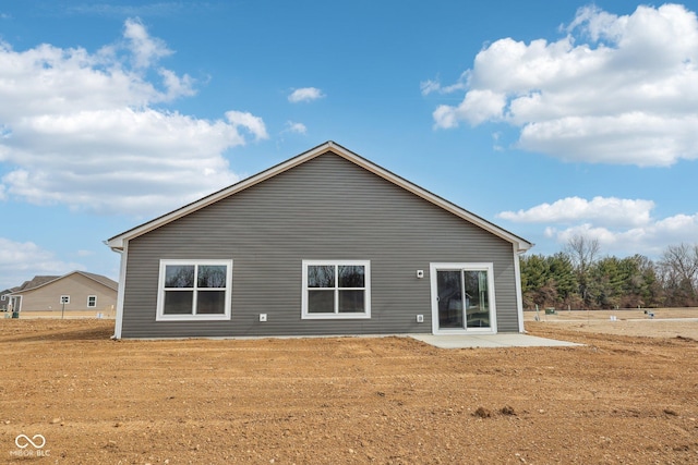 back of property featuring a patio area