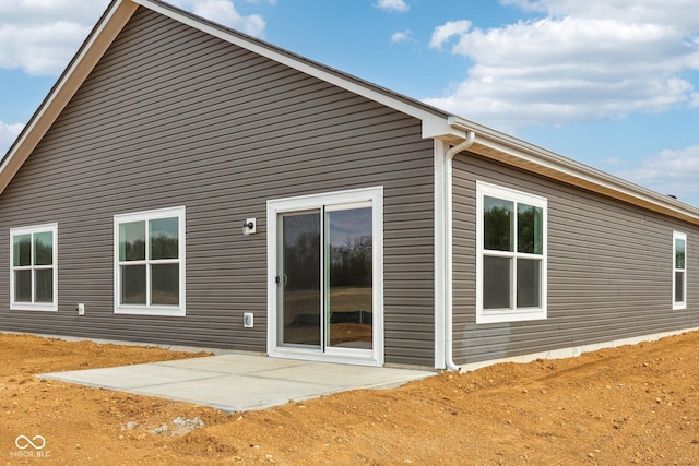 back of house with a patio